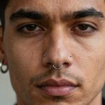 men embracing piercing fashion