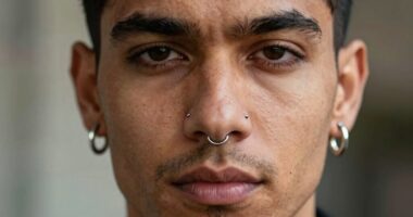 men embracing piercing fashion