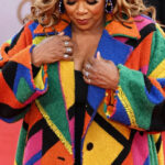 Queen Latifah Bundles Up in a Bold, Oversized Coat on the 2026 BET Awards Red Carpet
