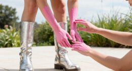 Doechii Embraces Alien-Esque Beauty In Pink Body Paint & Sky-High Moto Boots At Daisy Chain Fields Music Festival